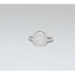 18ct White Gold ladies Diamond Halo set ring. Size O.