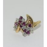 A 14ct yellow gold ruby and diamond ring in the Art Deco style. Size P