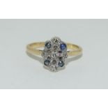 An Art Deco 18ct gold and platinum sapphire and diamond ring, Size M.