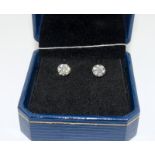 A pair of 18ct white gold stud earrings of 50 points.