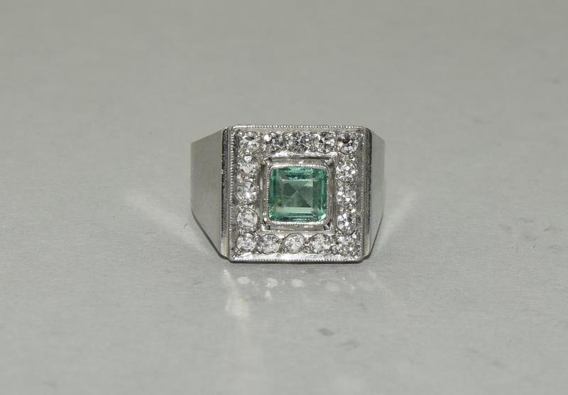 Platinum Art Deco Emerald Diamond ring.