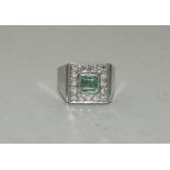 Platinum Art Deco Emerald Diamond ring.