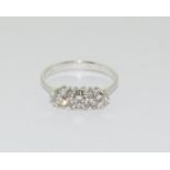 An 18ct white gold three stone diamond ring of 1.1cts.