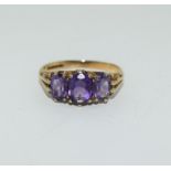 A Vintage three stone 9ct gold amethyst Ring, Size M 1/2, 2.6 grams.