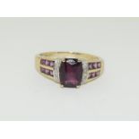 9ct Gold Ladies Garnet Diamond Surround Ring.