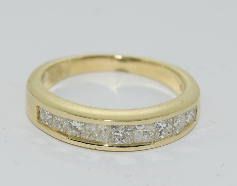 An 18ct yellow gold diamond set half eternity ring. Size N