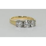 18ct Gold three stone Diamond ring - approx 1ct in total. Size J.