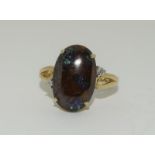 A large firey Boulder opal and Diamond 9ct Gold ring, Size K