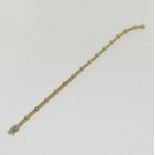 An 18ct yellow and white gold 1.05ct Diamond line bracelet, 12 grams.