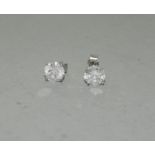 A pair of diamond stud earrings of 1.9cts on white gold posts.