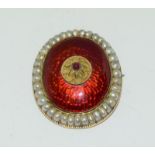 Georgian Yellow Metal Enamel Brooch set with Pearls and a central Garnet.