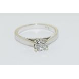 18ct white gold diamond solitaire ring - 0.58 points, Size M.