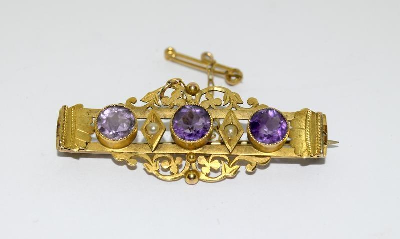 A late Victorian/Edwardian three stone Amethyst and Pearl Brooch.