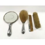 Four piece Silver dressing table set.