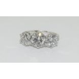 A very impressive 18ct white gold three stone diamond ring of 3.9cts. Size K