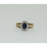 A Vintage 9ct gold sapphire and diamond cluster ring, size L, 2.3 grams.