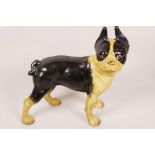 An iron doorstop figurine of a French bulldog painted black and white, 10" high