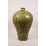 A Chinese olive green glazed crackleware meiping vase with raised phoenix decoration, 13½" high