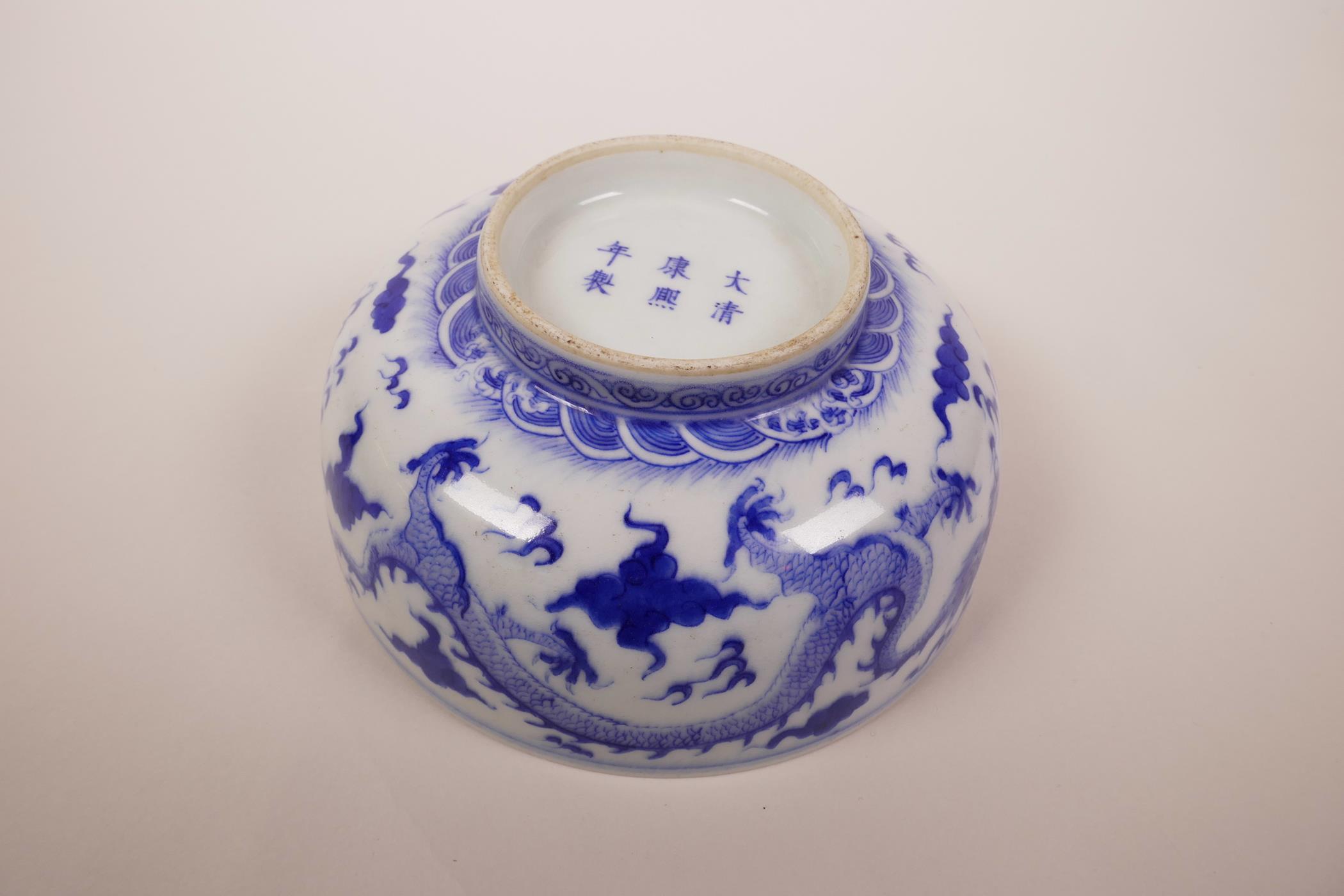 A Chinese blue and white porcelain bowl decorated with a dragon chasing the flaming pearl, 6 - Image 5 of 6