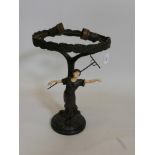 A bronze and faux ivory table lamp with a dancing harvester, possibly American, early C20th, A/F and