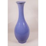 A tall Oriental blue crackle glazed long neck baluster vase with flared rim, 16½" high