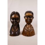 A pair of African carved wood busts of a man and woman, 11" high