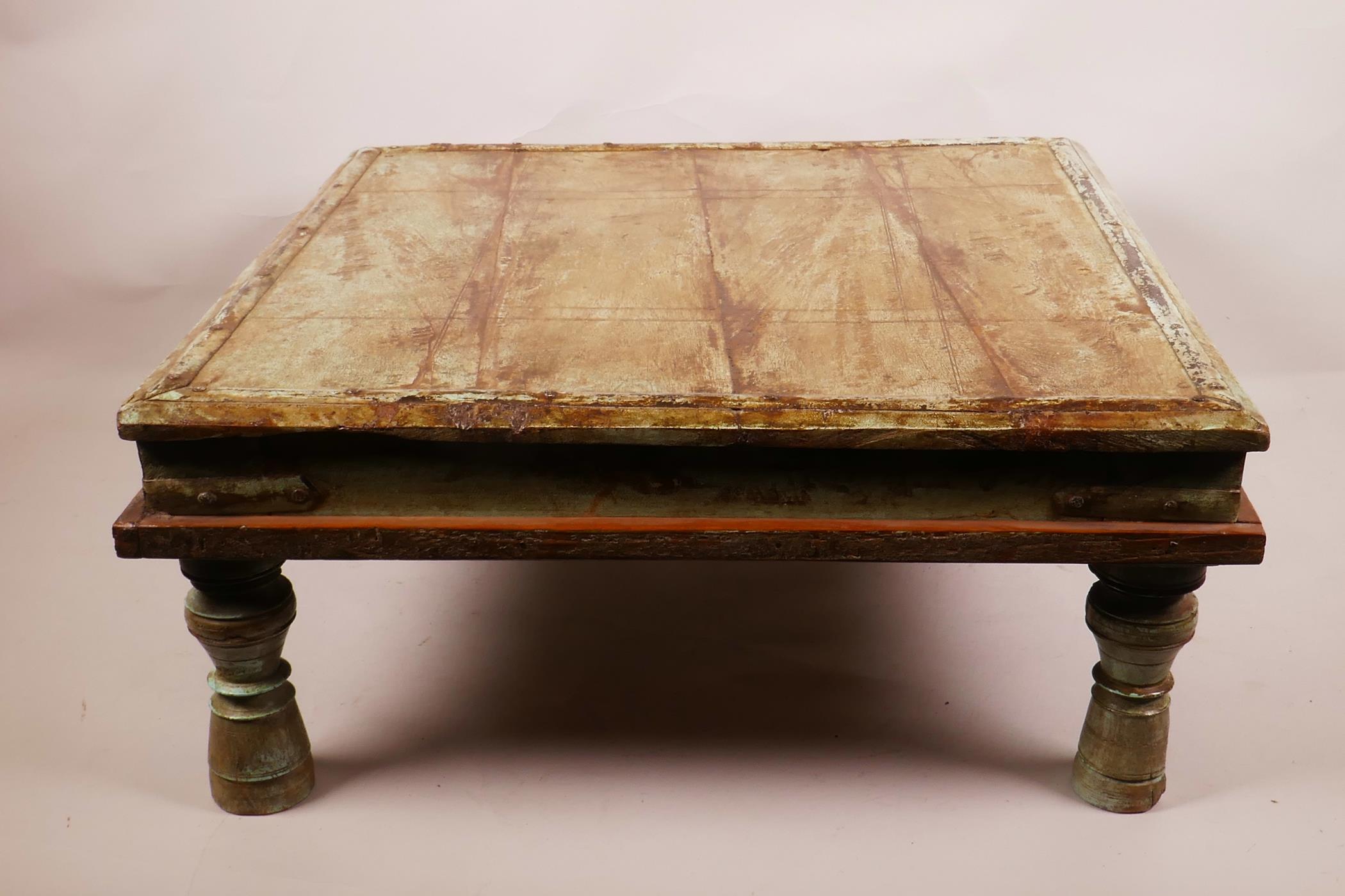 An Indian painted hardwood low coffee table, 17" x 17", 7½" high