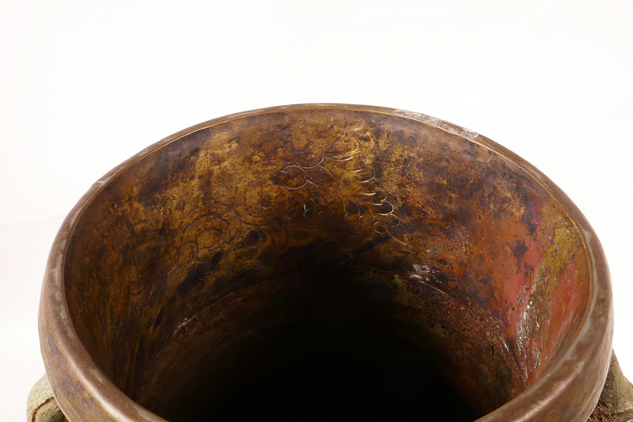 An Eastern pottery two handled vase with a turquoise glaze and copper rim, probably Indian, repair - Image 5 of 6