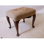 A Georgian walnut stool, raised on cabriole supports with pad feet, 20" x 16" x 18"