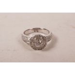 An 9ct white gold, diamond encrusted ring, approximate size 'M'