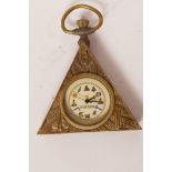 A pocket watch in a brass case decorated with Masonic symbols, 2" wide