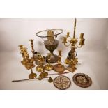 A quantity of brass candlesticks, lamps etc