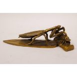 A Chinese bronze of a mantis attacking a cicada, 7½" long