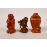 Three small Chinese boxwood carvings/netsuke in the form of Buddha, carved signature to bases,