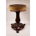 A William IV rosewood revolving piano stool on a carved, gadrooned column, 19" high