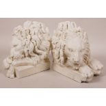 A pair of composition lion's head bookends, 5" high
