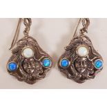 A pair of Art Nouveau style silver and opal earrings