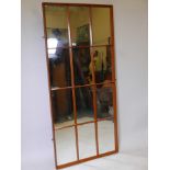 A teak sectional wall mirror, late C20th, 64" x 30"