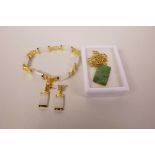 A Chinese gilt metal mounted jade pendant necklace, together with a white jade link bracelet and