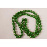 A green jade bead necklace, 32" long