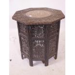 A C19th Anglo-Indian occasional table, with finely carved grape and vine decoration and inset top