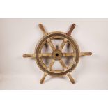 A vintage ship's wheel with bronze boss and mount, 20" diameter