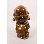 A Chinese bronze of a jolly Buddha, marks to base, 8½" high