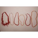 A collection of six coral necklaces, one clasp A/F