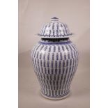 A Chinese blue and white pottery jar and cover with all over character inscription decoration, 4