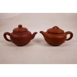 A Chinese Yixing teapot with chased landscape decoration and character inscription, together with