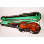 A Chinese 'Blessing' violin with a two piece back, with two bows and fitted case, 23" long
