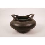 A Chinese bronze censer on tripod supports with twin phoenix eye handles, two character mark to