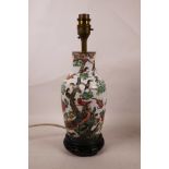 A C19th Chinese famille verte porcelain vase decorated with a phoenix and Asiatic birds, converted