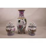 A pair of Chinese famille rose Republic style porcelain ginger jars, together with a similar vase